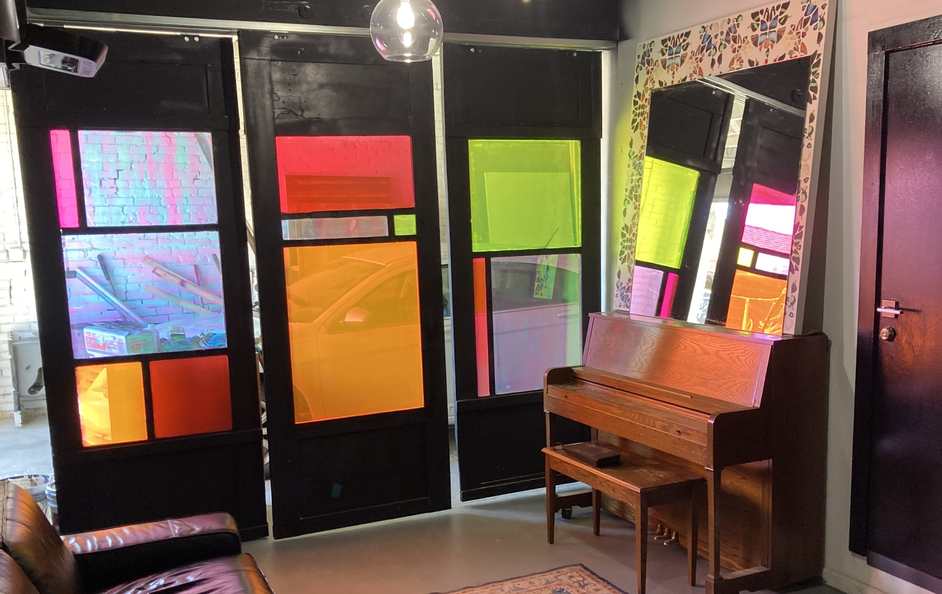 Sliding barn doors with stained glass feature in Boyle Heights renovation