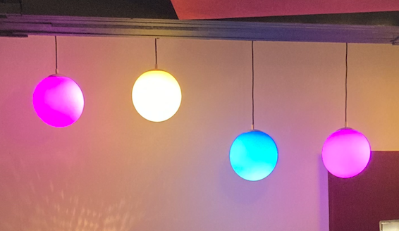 Globe lights in pink, yellow, and blue custom fabrication